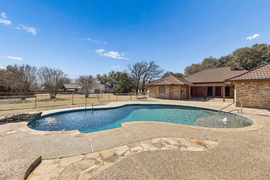 241 Simmons Road Double Oak, TX 75077 - Photo 38 of 40 View of pool with patio surround and a fenced backyard