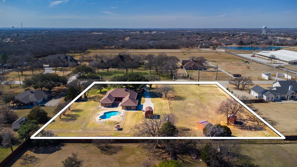 241 Simmons Road Double Oak, TX 75077 - Photo 5 of 40 Aerial overview of property's location with property boundaries highlighted and a large body of water