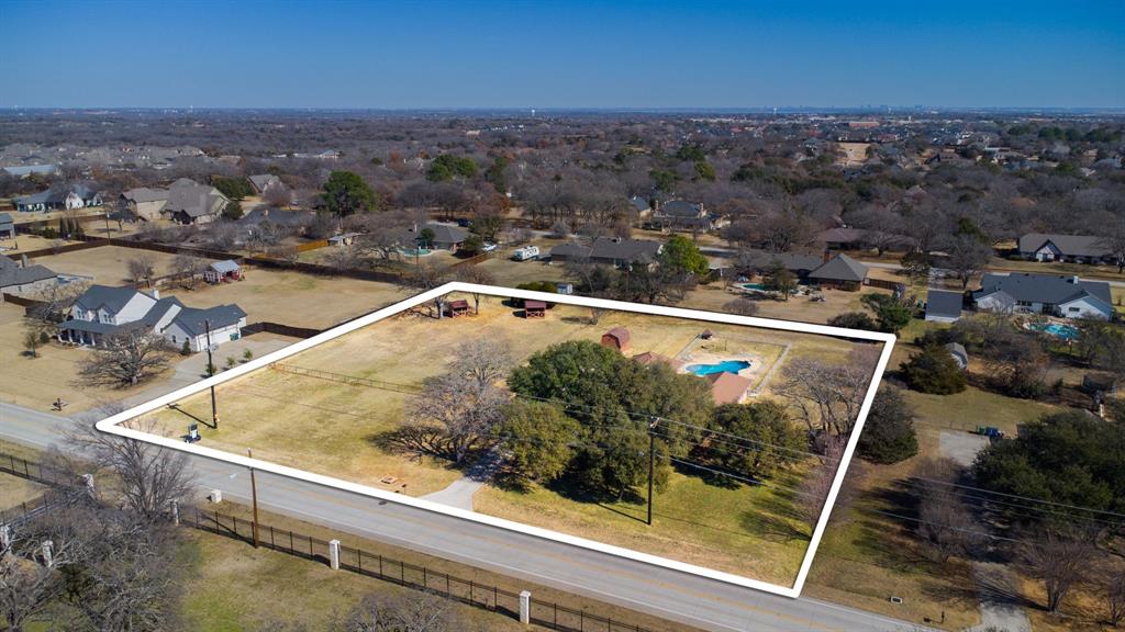 241 Simmons Road Double Oak, TX 75077 - Photo 6 of 40 Aerial view of residential area with property boundaries highlighted