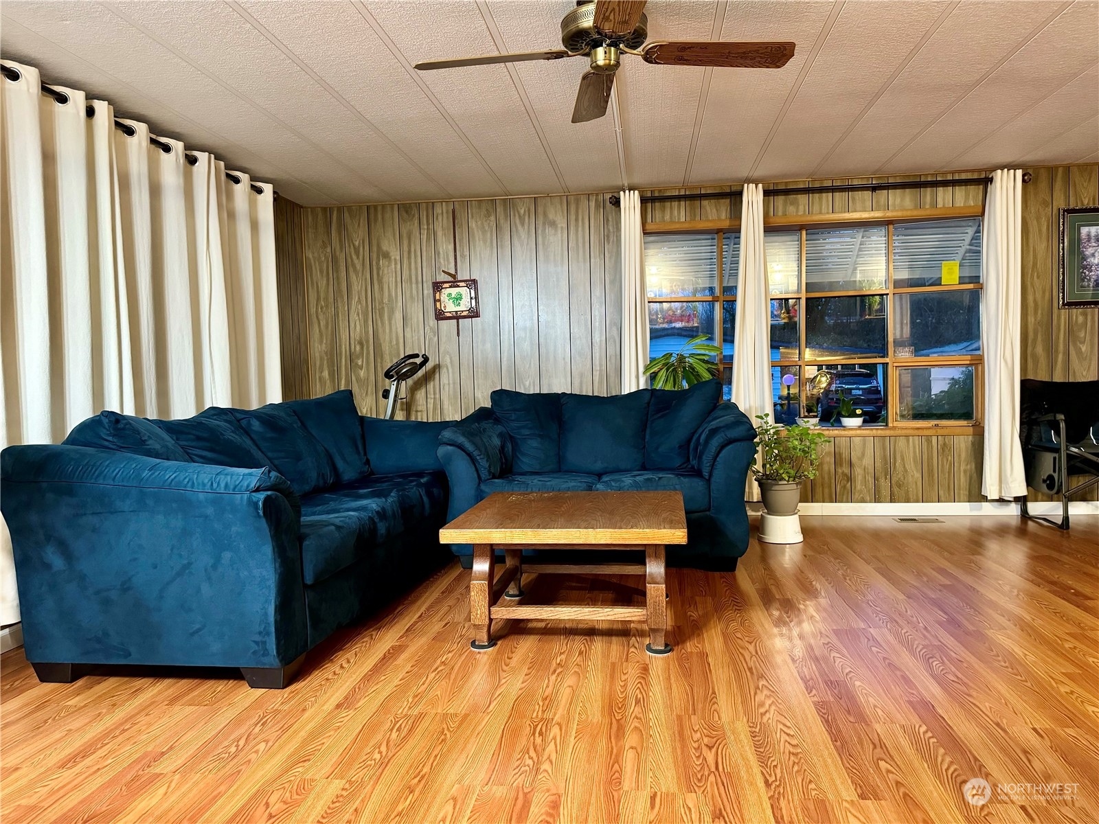 201 Union Avenue Southeast, Unit 142 Renton, WA 98059 - Photo 8 of 20 a living room with furniture and wooden floor