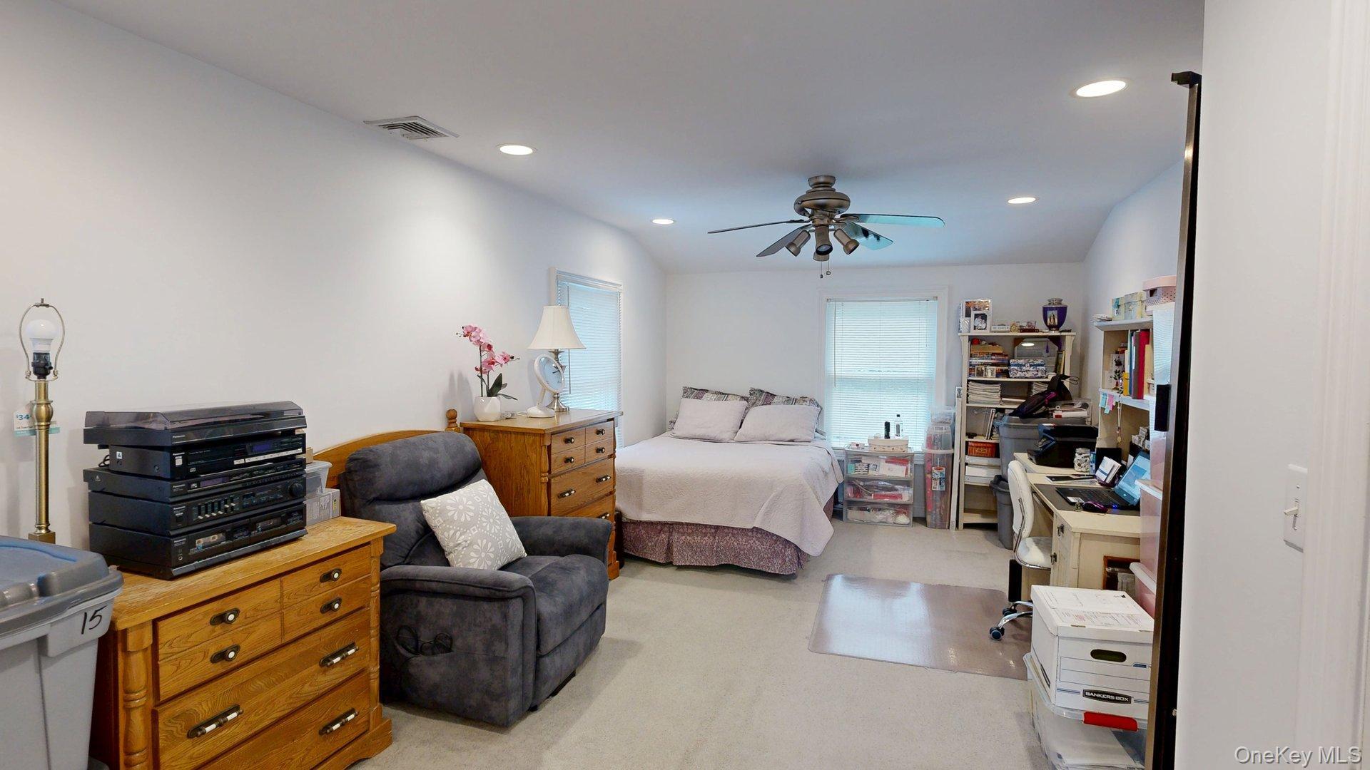 15 Woodbine Road Irvington, NY 10533 - Photo 12 of 20 a living room with furniture and a flat screen tv