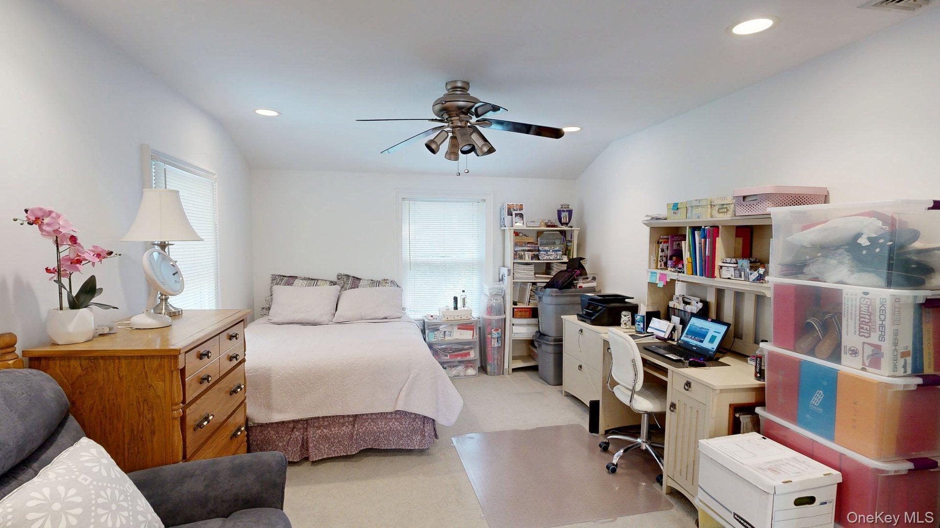15 Woodbine Road Irvington, NY 10533 - Photo 13 of 20 a bedroom with a bed a study table and a window