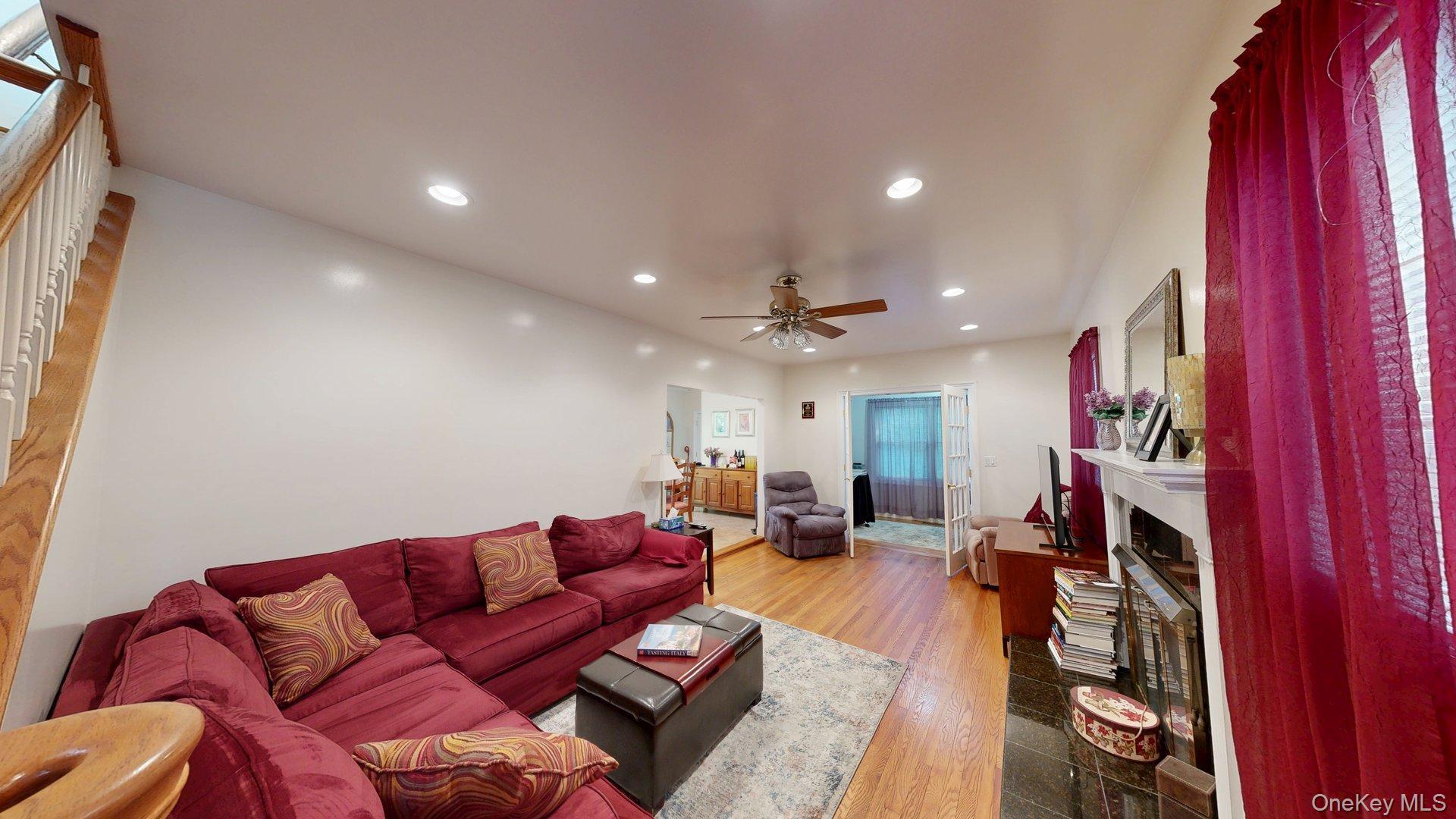 15 Woodbine Road Irvington, NY 10533 - Photo 3 of 20 a living room with furniture and a flat screen tv