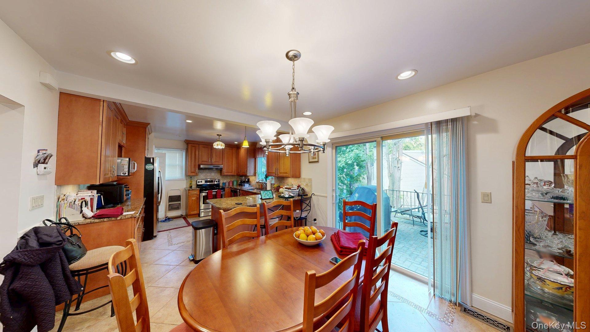 15 Woodbine Road Irvington, NY 10533 - Photo 7 of 20 a view of a dining room with furniture window and wooden floor