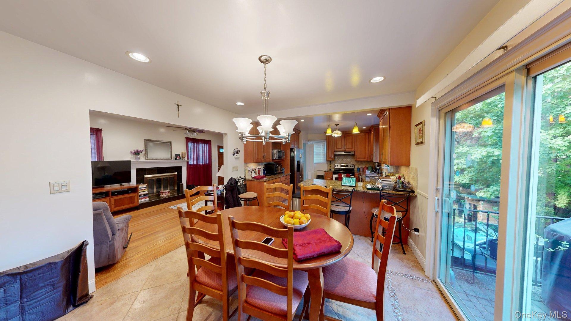 15 Woodbine Road Irvington, NY 10533 - Photo 9 of 20 a view of a dining room with furniture window and wooden floor