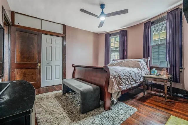 a bedroom with a bed and a window