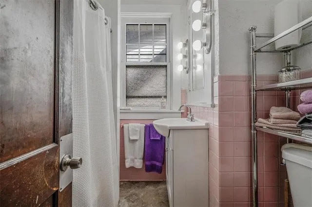 a bedroom with furniture and a window