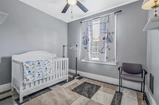 a bedroom with a bed and a fireplace