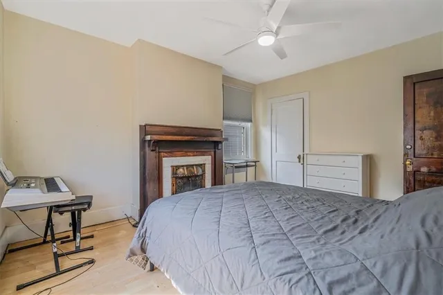a view of hallway with wooden floor and closet