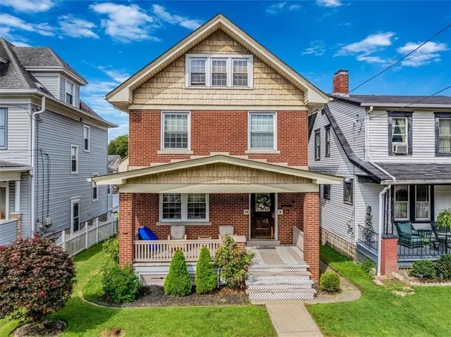 an aerial view of houses with outdoor space