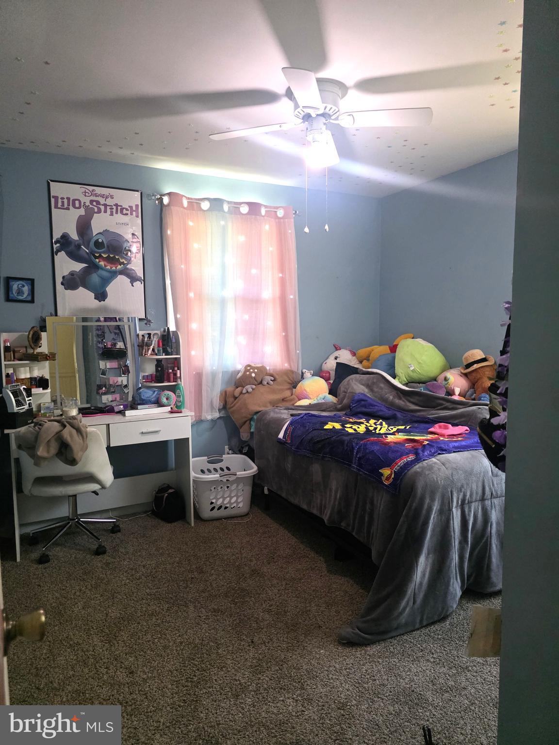 537 Centerton Road Pittsgrove, NJ 08318 - Photo 12 of 28 a bedroom with a bed and a chandelier