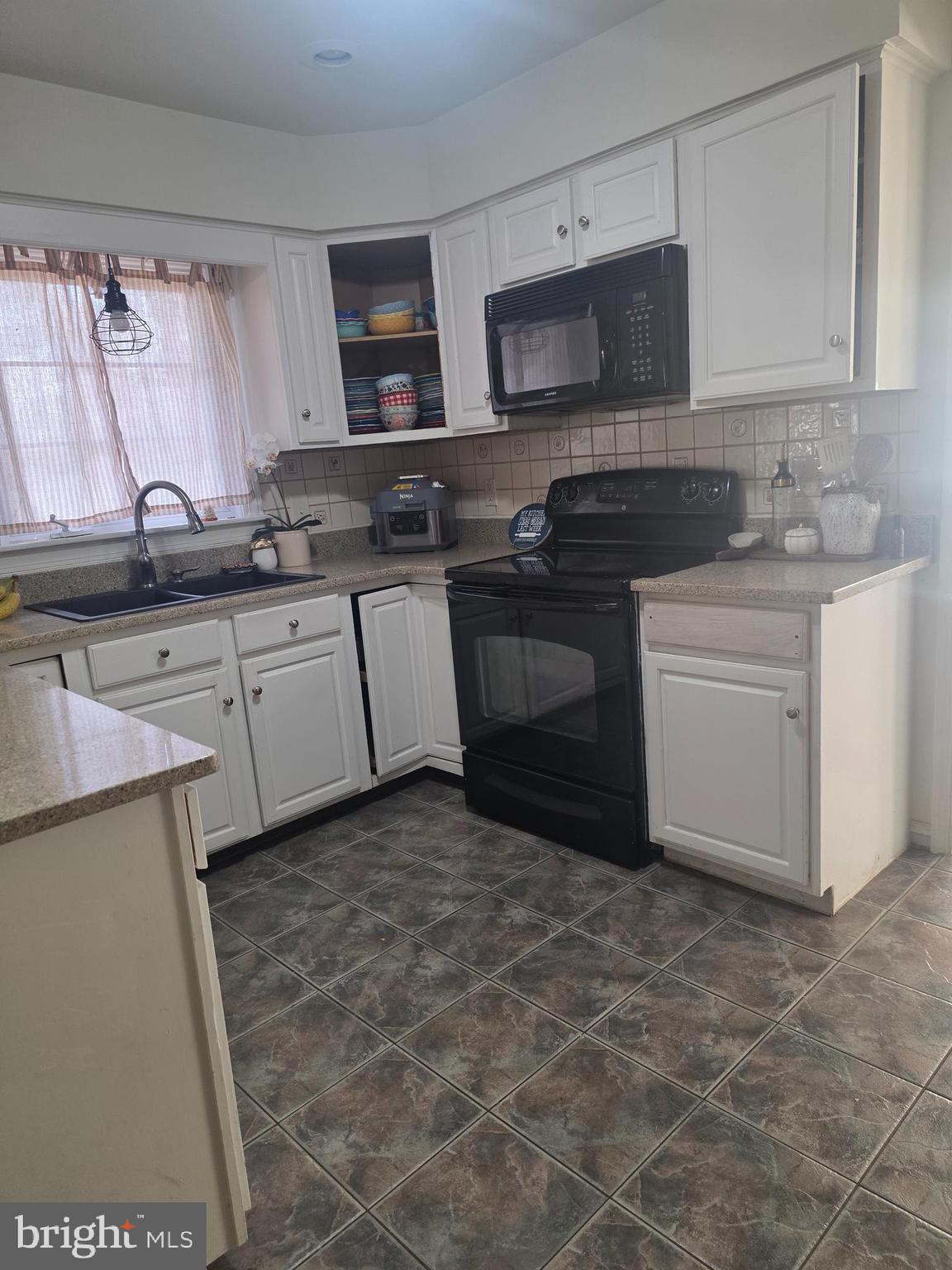 537 Centerton Road Pittsgrove, NJ 08318 - Photo 13 of 28 a kitchen with stainless steel appliances granite countertop a sink a stove a microwave a counter space and cabinets