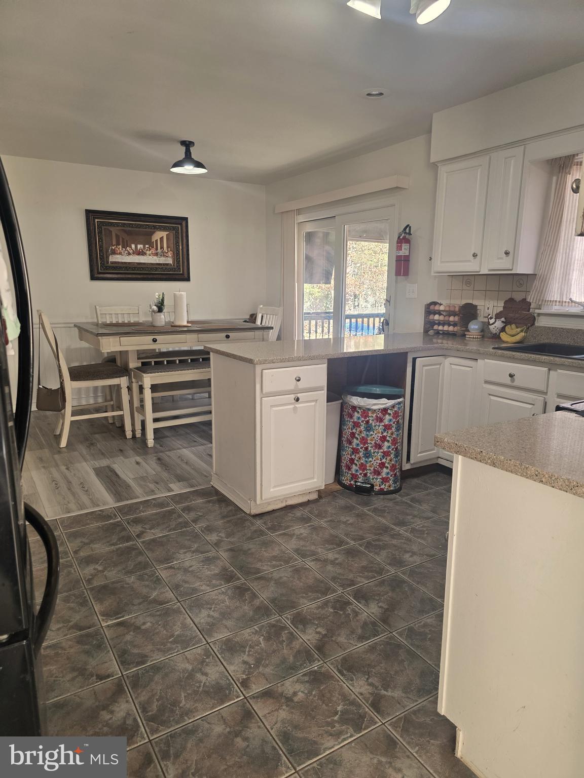537 Centerton Road Pittsgrove, NJ 08318 - Photo 17 of 28 a large kitchen with cabinets and wooden floor
