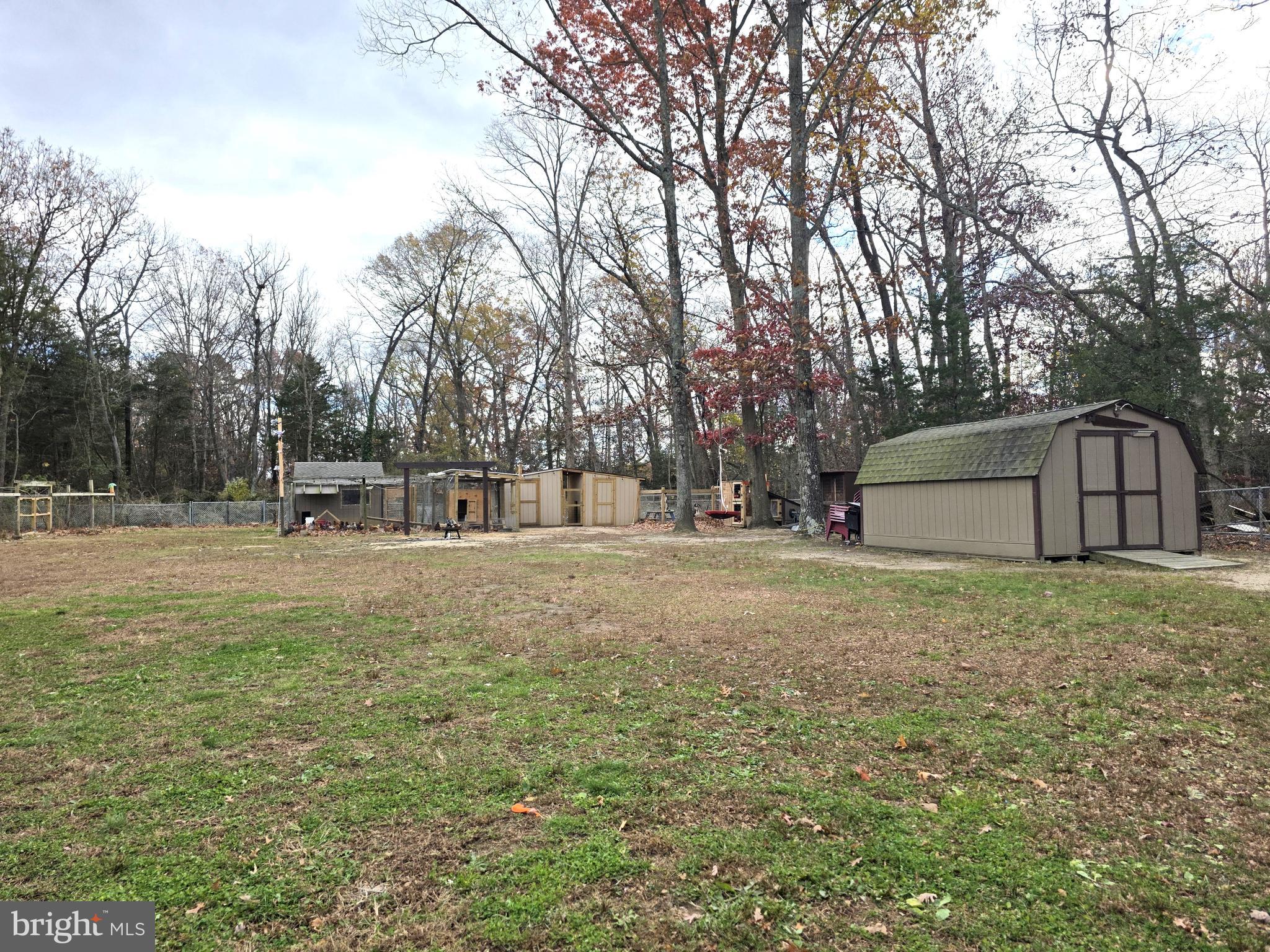 537 Centerton Road Pittsgrove, NJ 08318 - Photo 27 of 28 a front view of a house with a yard and trees