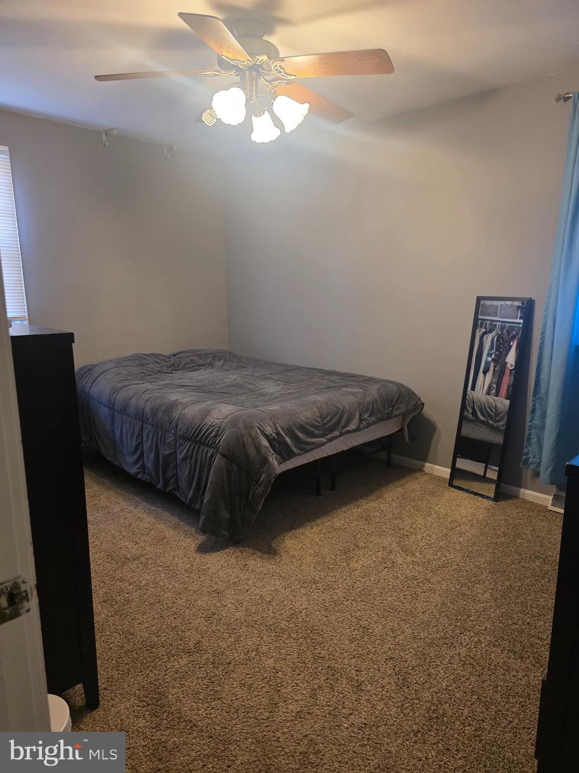 537 Centerton Road Pittsgrove, NJ 08318 - Photo 10 of 28 a bed sitting in a bedroom next to a window