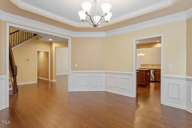 a kitchen with stainless steel appliances granite countertop a refrigerator a sink and a stove