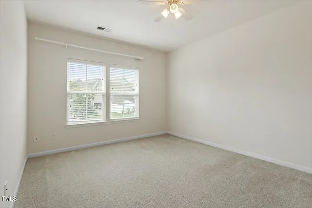 a view of staircase with railing and a chandelier