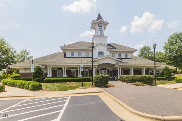 a view of a livingroom with wooden floor and window