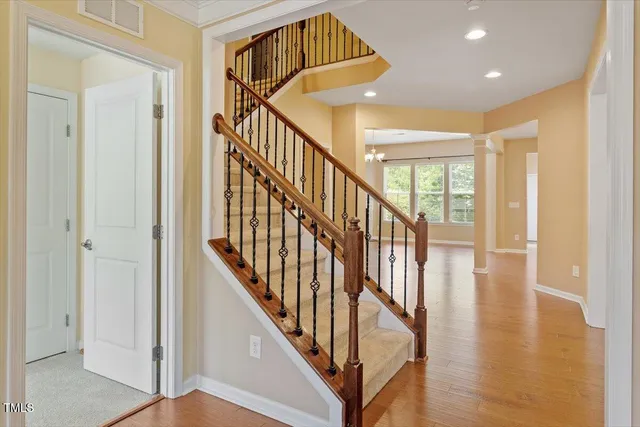 a view of an entryway with wooden floor