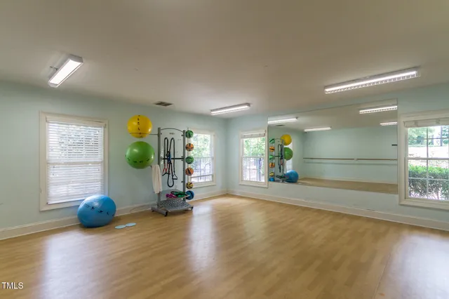 a view of a lake with houses in the back