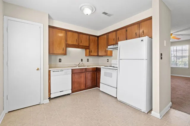 a bathroom with a sink toilet and vanity