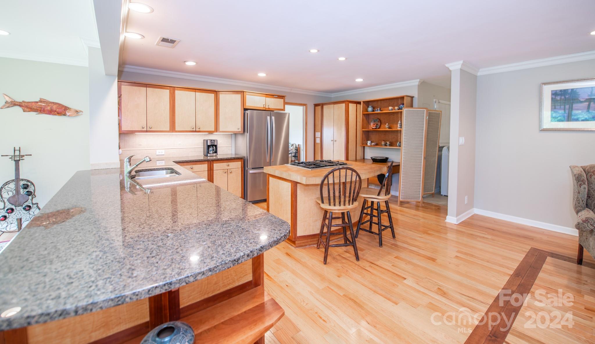 4000 Lake Shore Road South Denver, NC 28037 - Photo 13 of 46 a kitchen with stainless steel appliances granite countertop table chairs and wooden floor