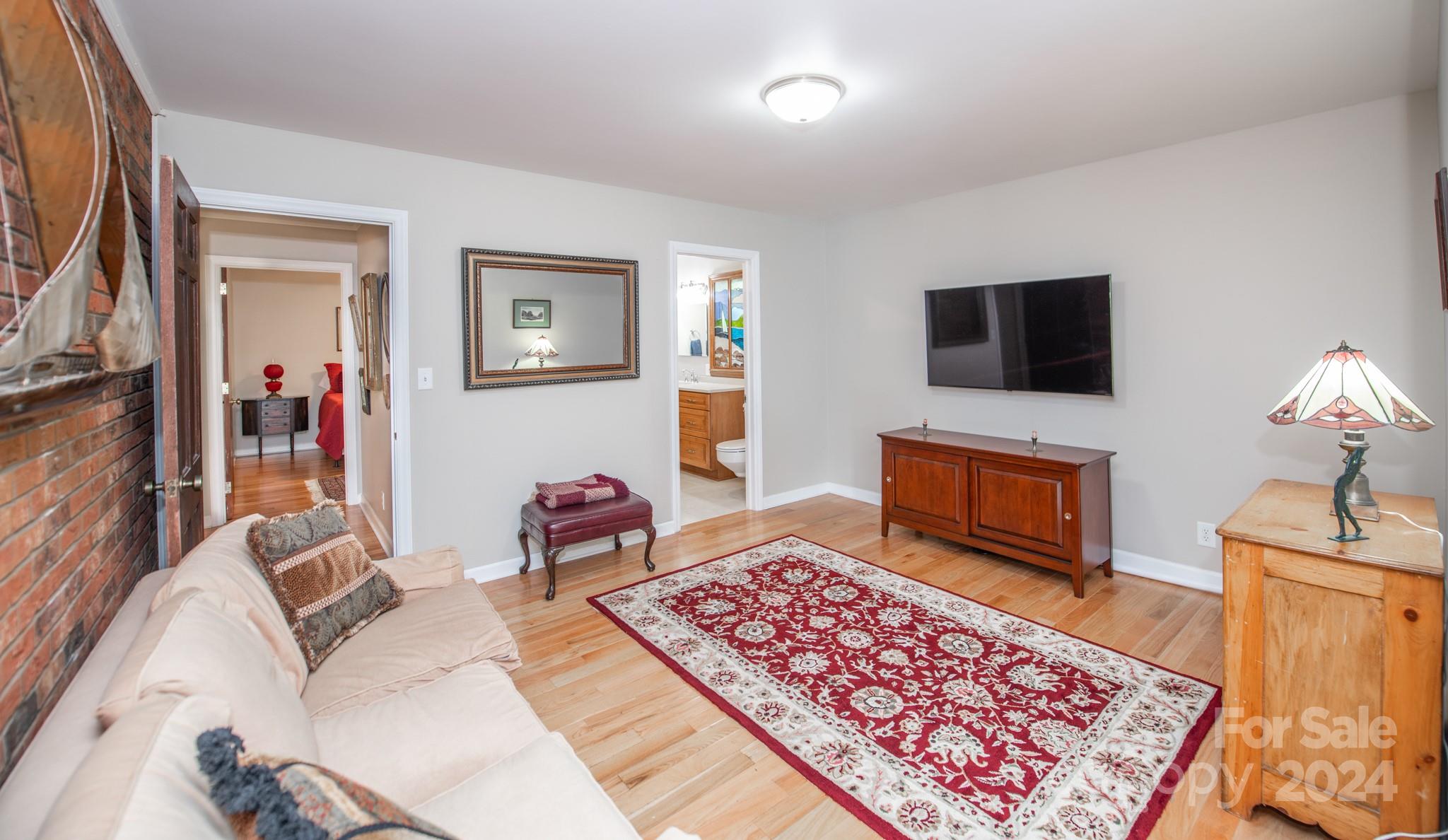 4000 Lake Shore Road South Denver, NC 28037 - Photo 20 of 46 a living room with furniture and a flat screen tv