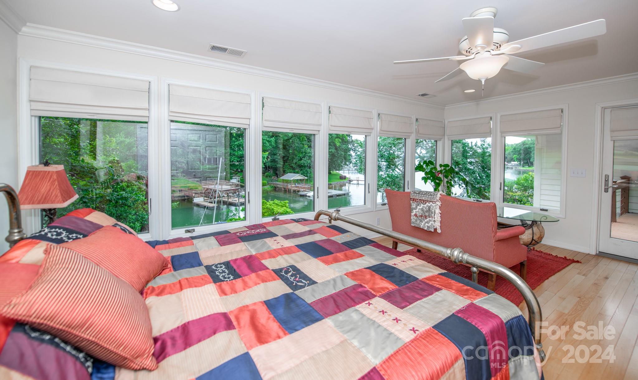 4000 Lake Shore Road South Denver, NC 28037 - Photo 21 of 46 a bed sitting in a bedroom next to a large window