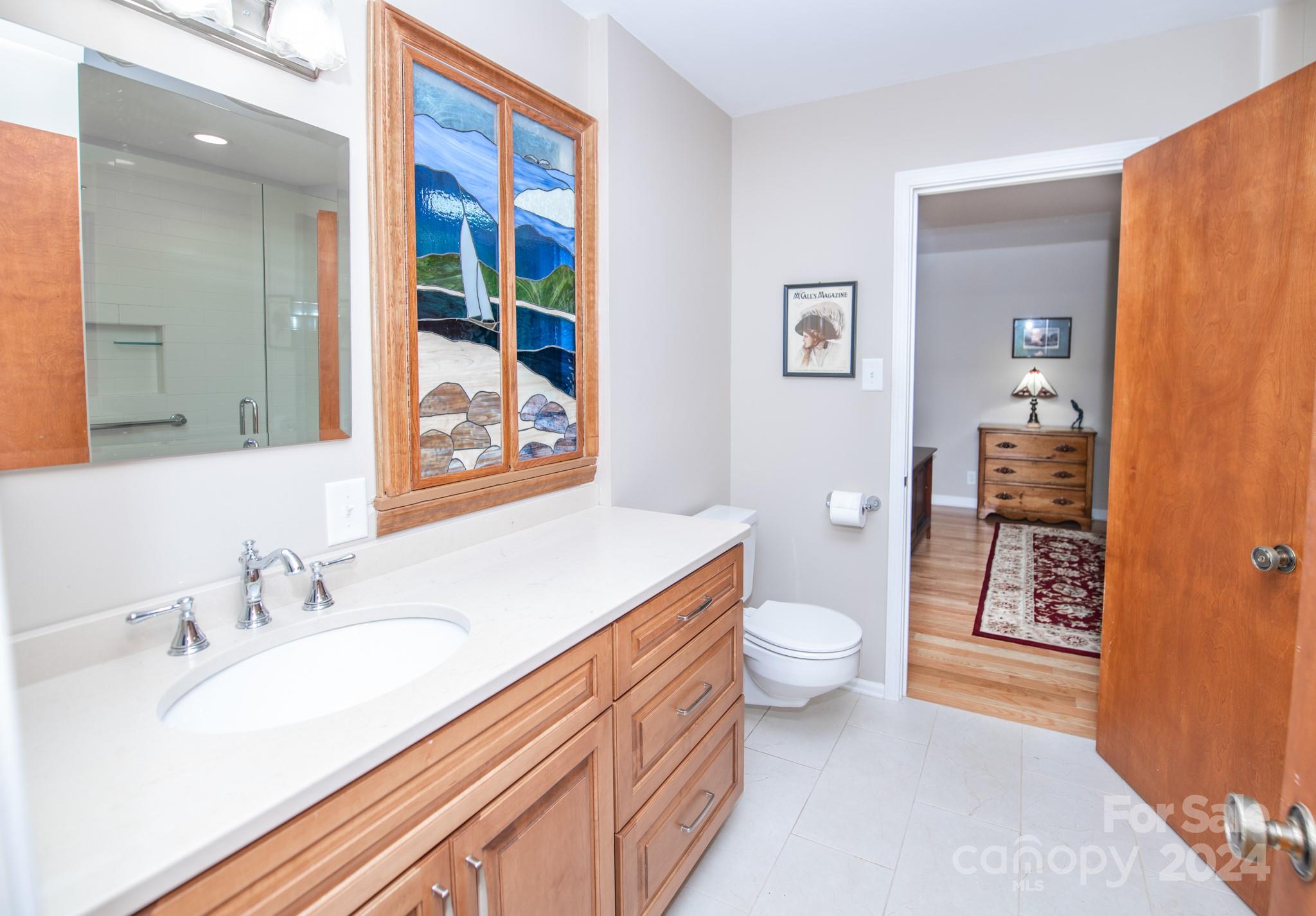 4000 Lake Shore Road South Denver, NC 28037 - Photo 26 of 46 a bathroom with a granite countertop sink toilet and shower