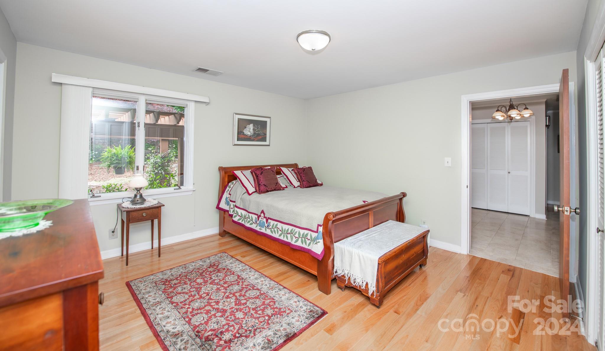 4000 Lake Shore Road South Denver, NC 28037 - Photo 28 of 46 a bedroom with a bed and a table in it