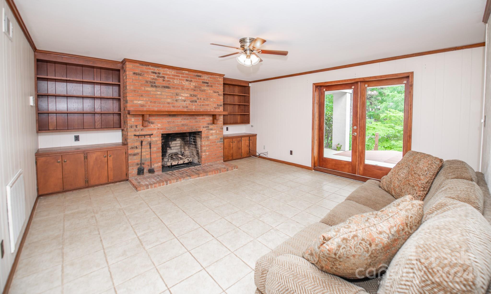 4000 Lake Shore Road South Denver, NC 28037 - Photo 33 of 46 a living room with furniture and a fireplace