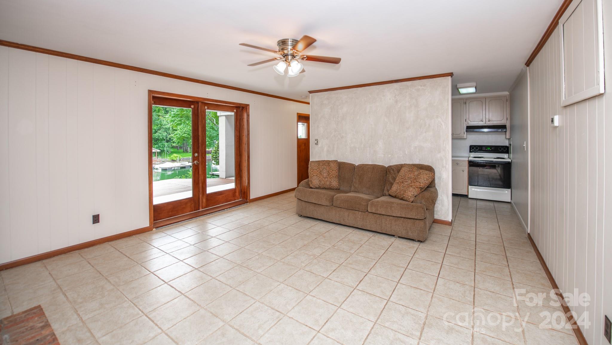 4000 Lake Shore Road South Denver, NC 28037 - Photo 35 of 46 a living room with furniture and a chandelier