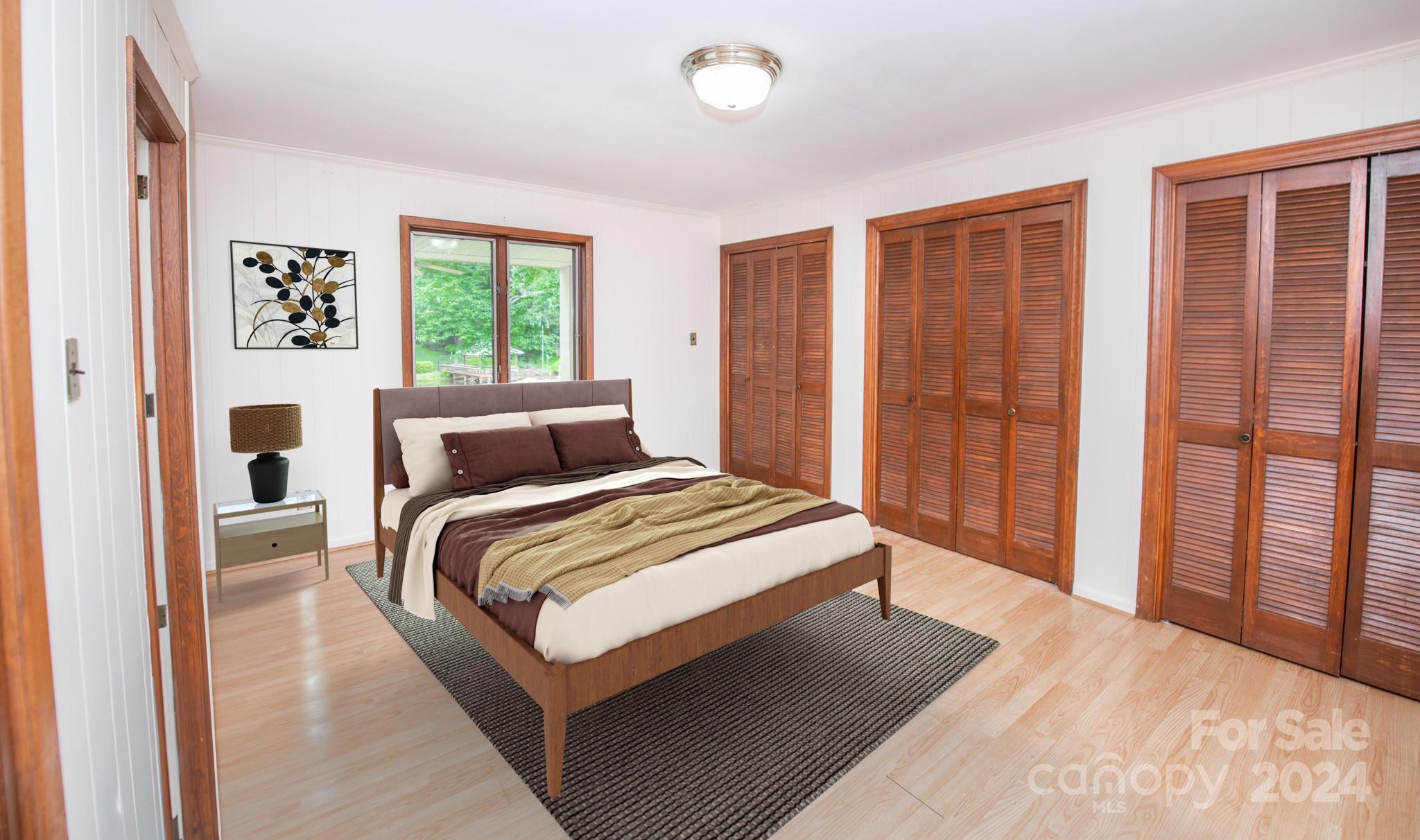 4000 Lake Shore Road South Denver, NC 28037 - Photo 36 of 46 a bedroom with a bed lamp and a large window