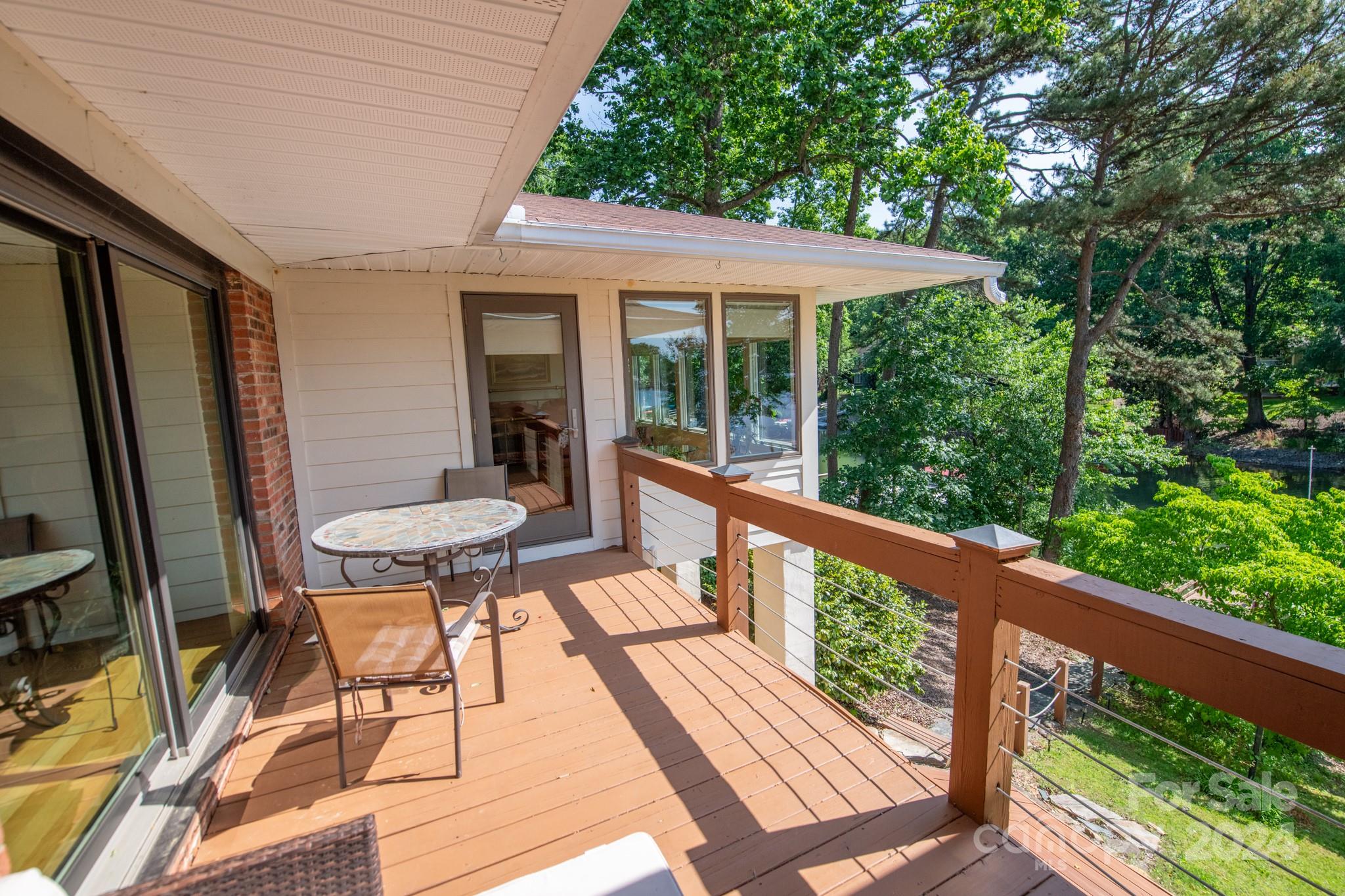 4000 Lake Shore Road South Denver, NC 28037 - Photo 46 of 46 a balcony with wooden floor table and chairs