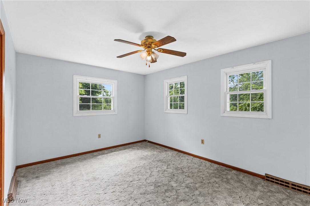 59937 Broadview Road Shadyside, OH 43947 - Photo 21 of 36 Carpeted spare room featuring plenty of natural light and a ceiling fan