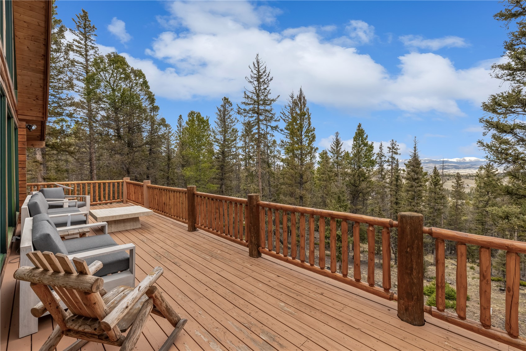 999 Bowstring Como, CO 80456 - Photo 33 of 37 a view of a roof deck with couches and wooden floor