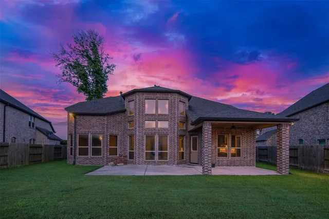 a front view of a house with a garden and porch