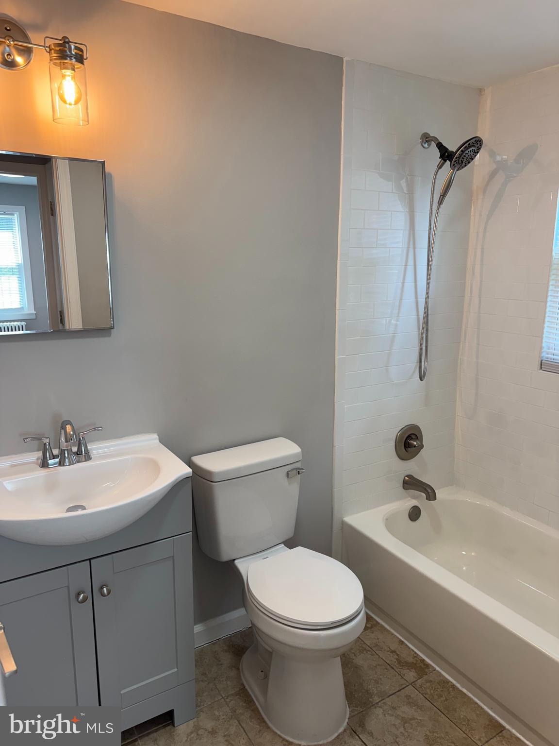 515 45th Street Northeast Washington, DC 20019 - Photo 5 of 11 a bathroom with a sink a toilet and shower