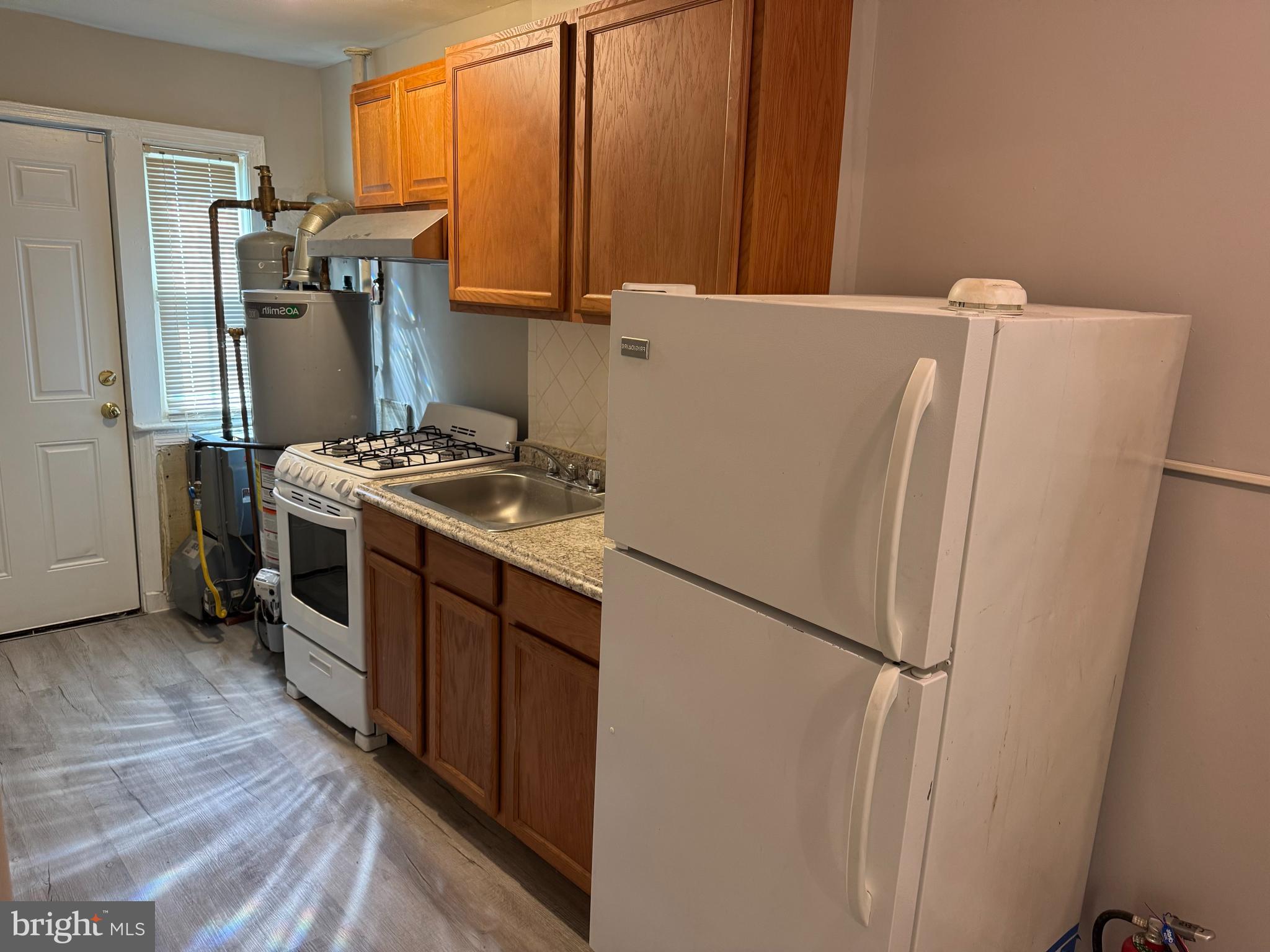 515 45th Street Northeast Washington, DC 20019 - Photo 8 of 11 a kitchen with stainless steel appliances a refrigerator and a stove