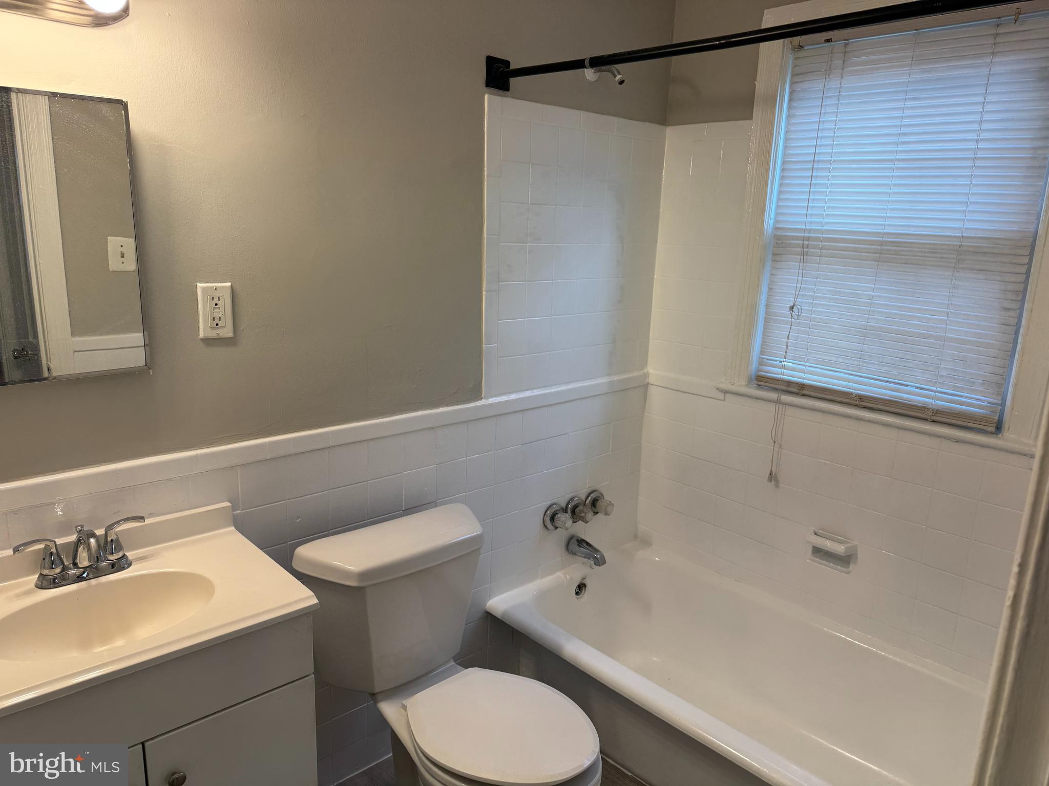 515 45th Street Northeast Washington, DC 20019 - Photo 9 of 11 a bathroom with a sink toilet and shower