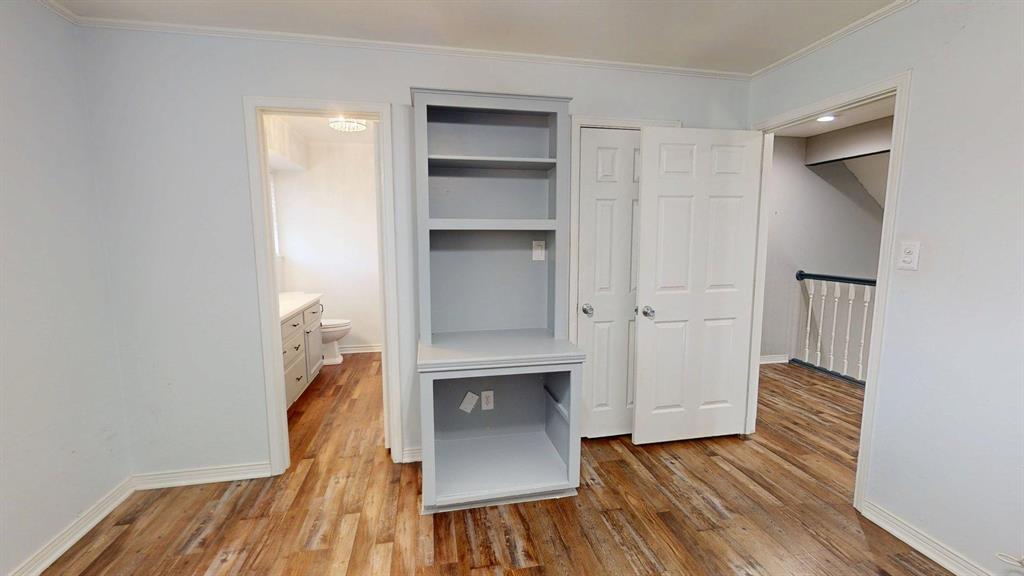908 Rolling Drive Athens, TX 75751 - Photo 26 of 31 an empty room with wooden floor closet and windows