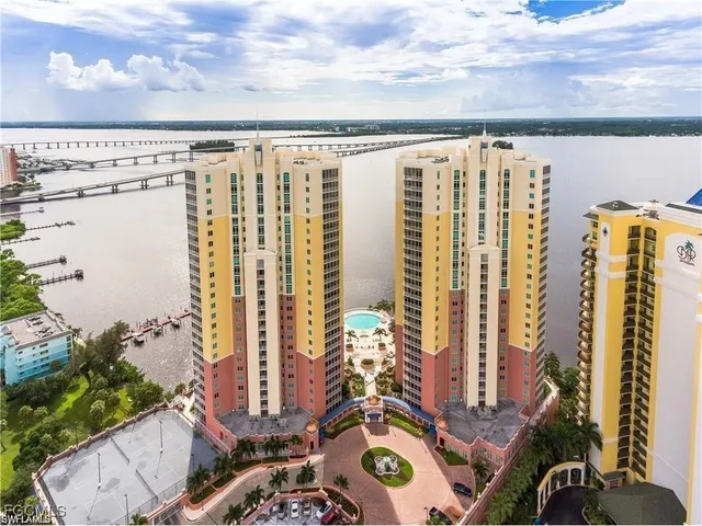 a large bed sitting in a bedroom next to a bathroom