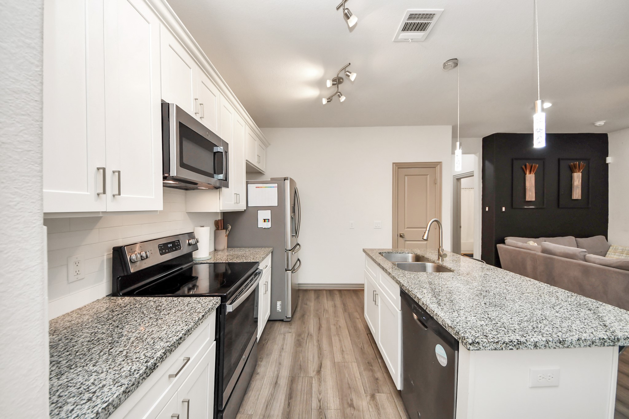 5334 Pershing Street Houston, TX 77033 - Photo 32 of 43 a kitchen with stainless steel appliances granite countertop a sink stove and refrigerator