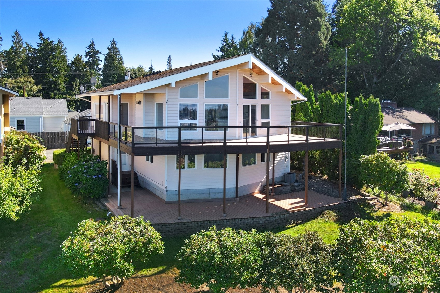 a view of a house with yard and sitting area