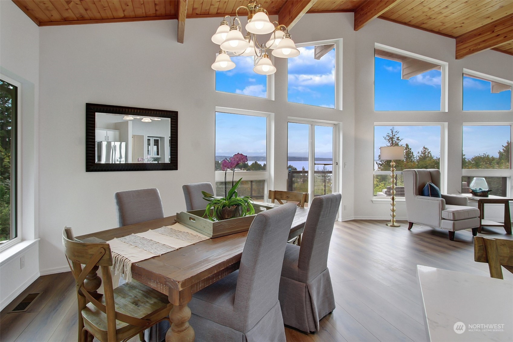 4824 Seahurst Avenue Everett, WA 98203 - Photo 11 of 33 a view of a dining room with furniture a chandelier and a large window