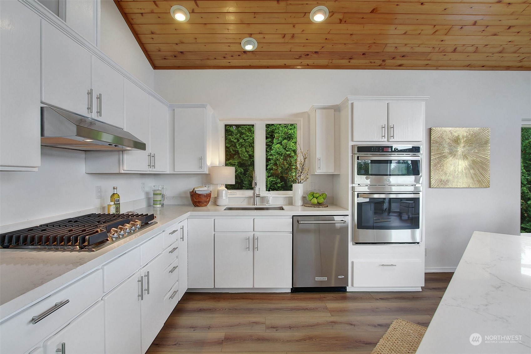 4824 Seahurst Avenue Everett, WA 98203 - Photo 13 of 33 a kitchen with stainless steel appliances a stove a sink and white cabinets