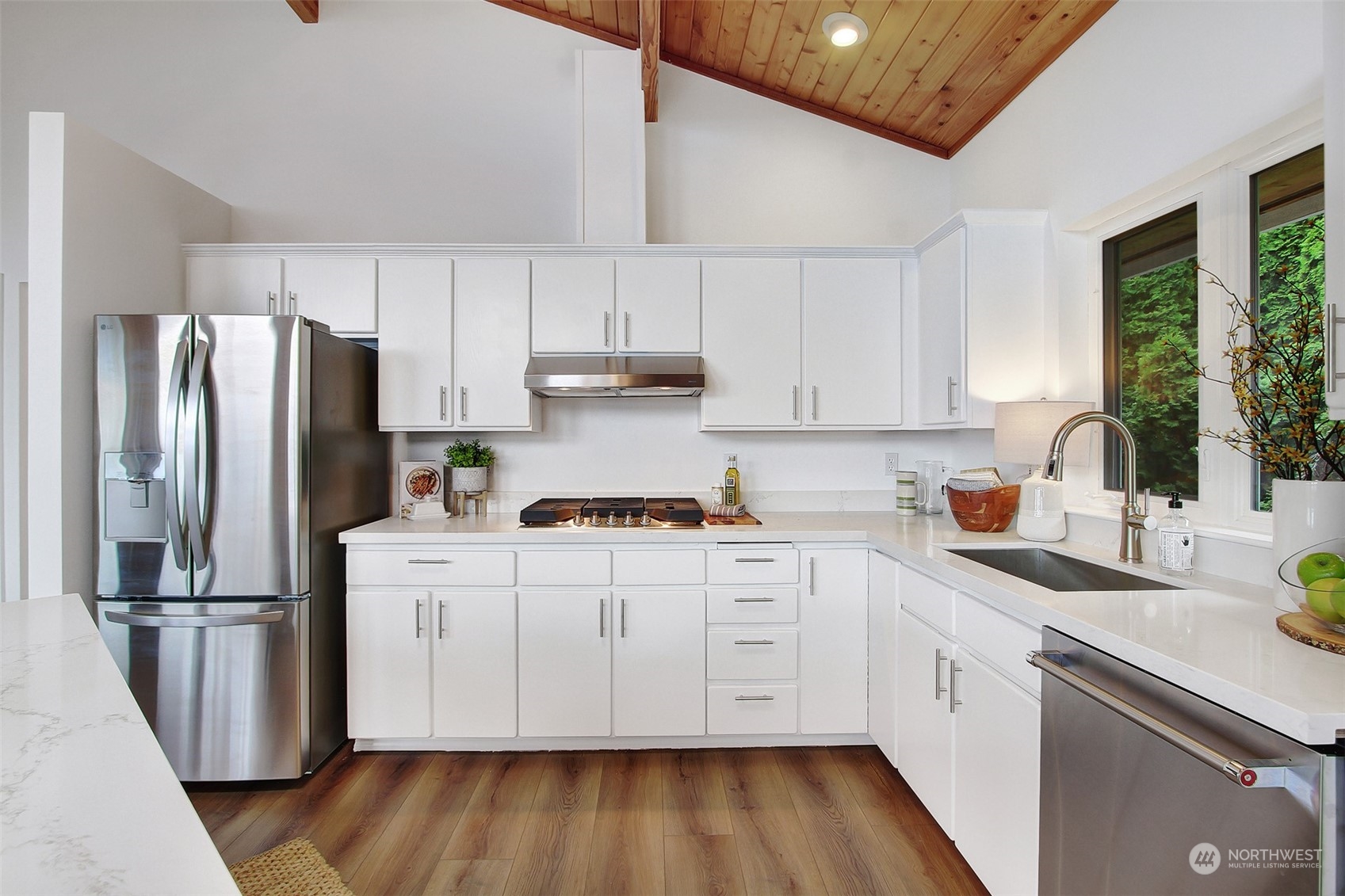 4824 Seahurst Avenue Everett, WA 98203 - Photo 14 of 33 a kitchen with white cabinets and stainless steel appliances