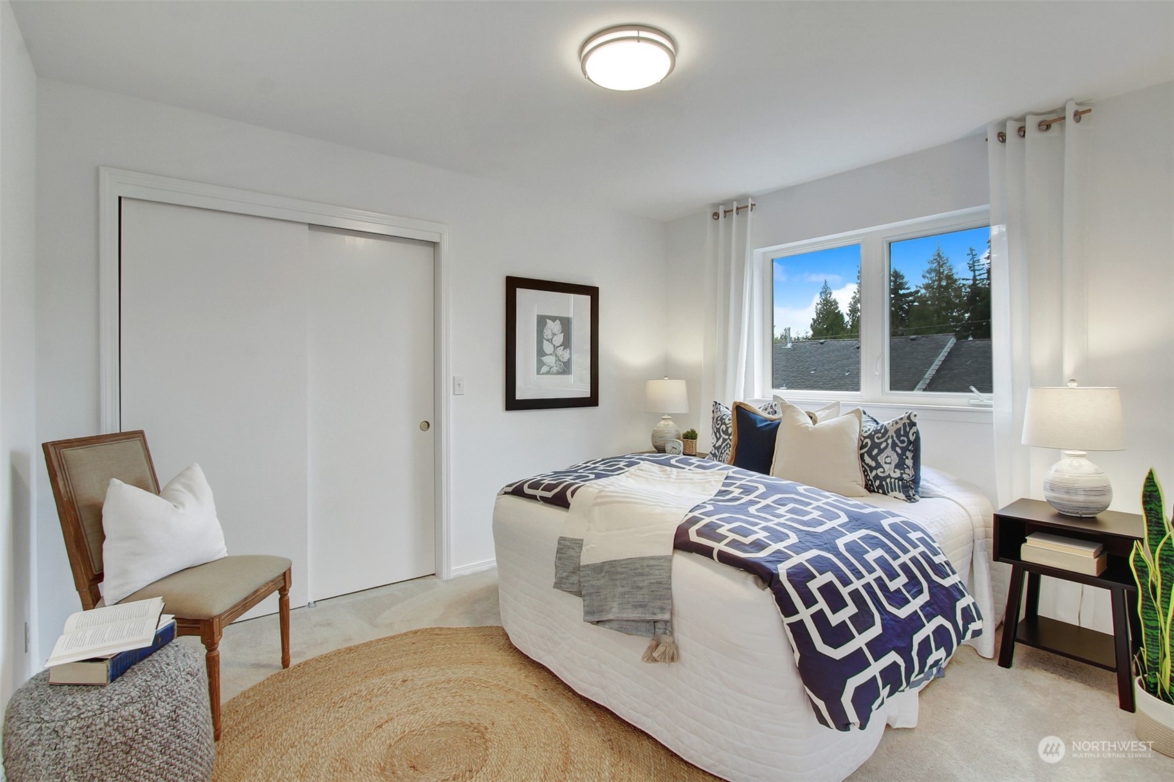 4824 Seahurst Avenue Everett, WA 98203 - Photo 23 of 33 a bedroom with a bed and a chair