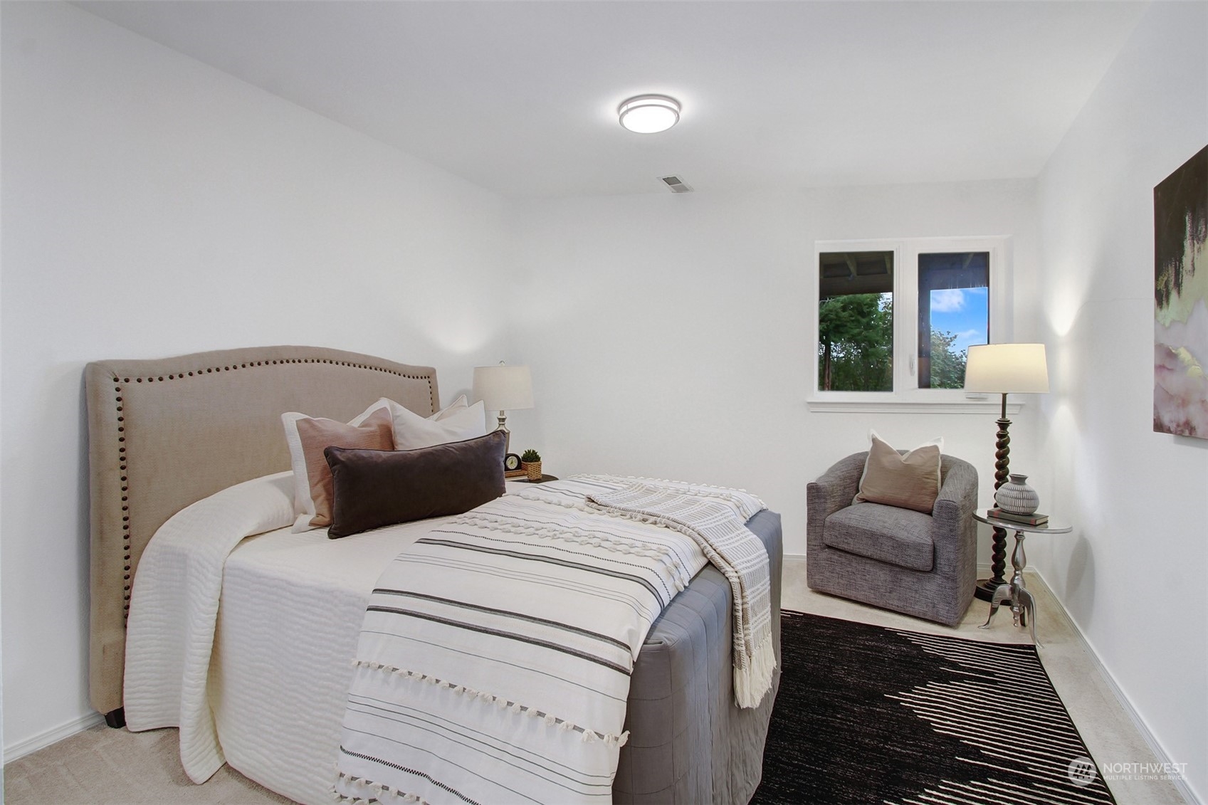 4824 Seahurst Avenue Everett, WA 98203 - Photo 29 of 33 a bedroom with a bed and a couch