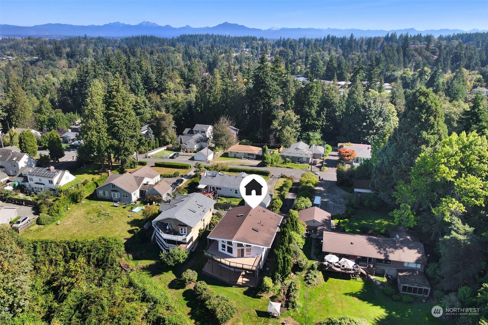 4824 Seahurst Avenue Everett, WA 98203 - Photo 3 of 33 a view of a house with a garden and lake view